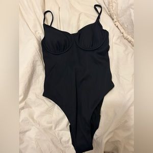 Roxy one piece black swimsuit brand new with tags and hygienic pad.